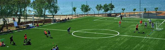 kids playng soccer in Kalimera Kriti Hotel's Teenager Club